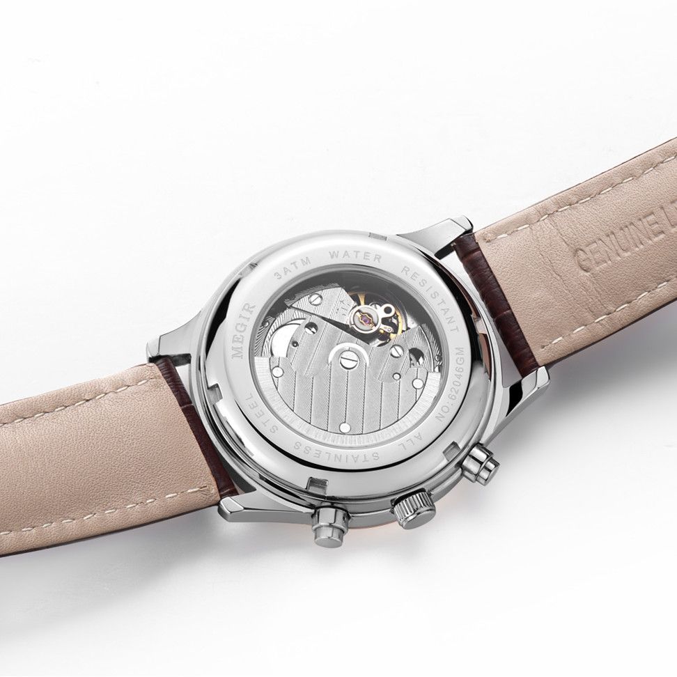 MEGIR 62046 men's moon-phase automatic watch exhibition caseback close-up showing the mechanical movement