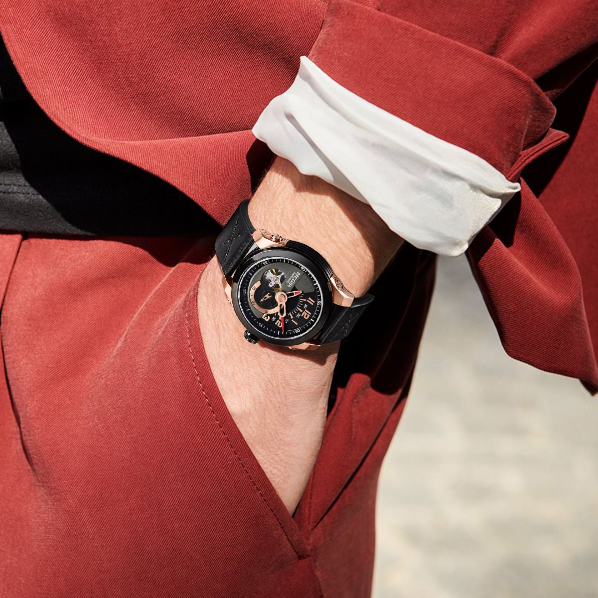 MEGIR 62050 automatic watch on the wrist, rose-gold and black case, black open-heart dial and black strap, red suit