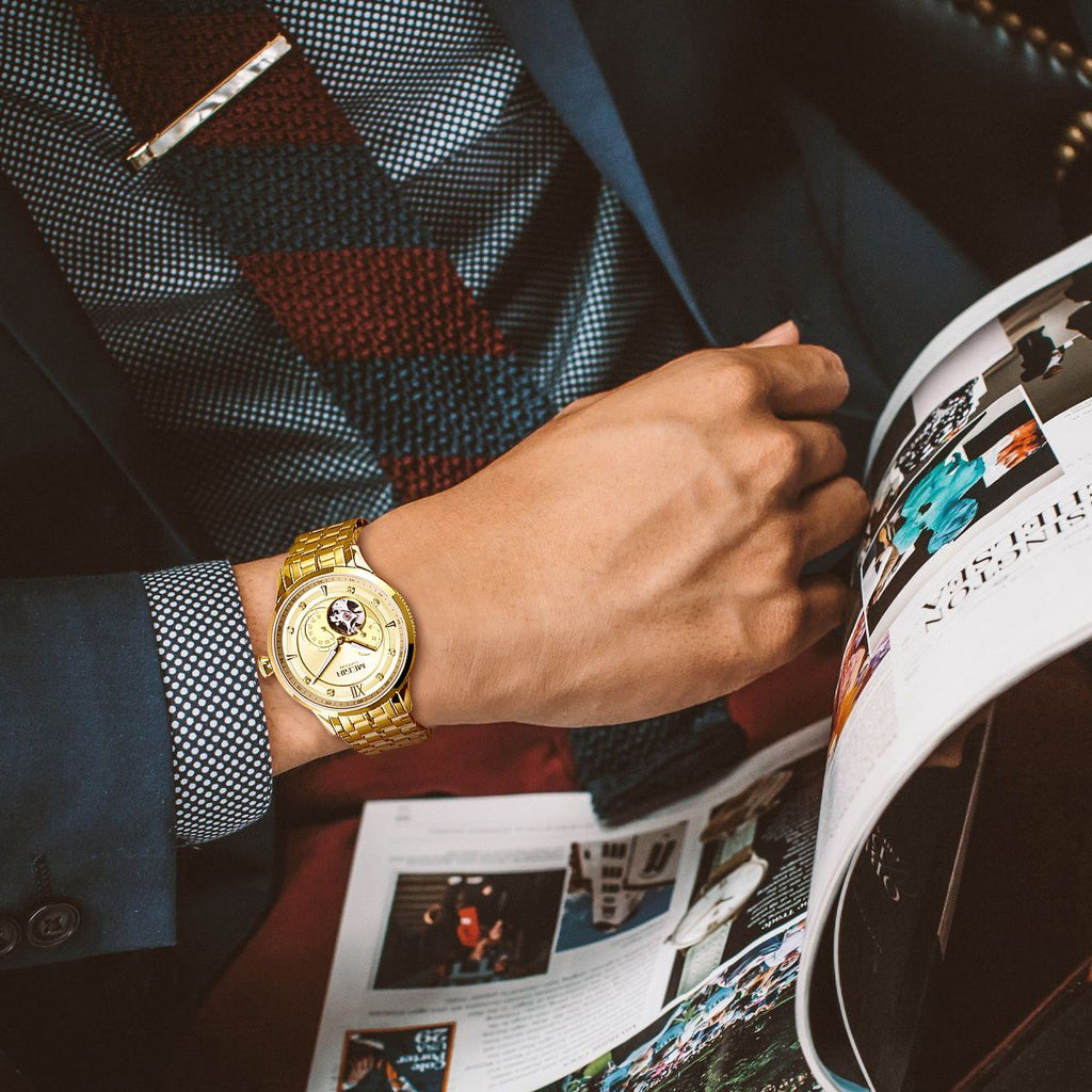 MEGIR 62053 automatic watch on the wrist, gold-tone case and bracelet with gold open-heart dial, with magazine