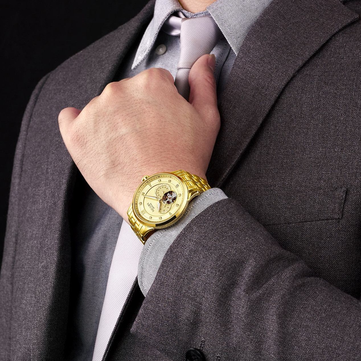 MEGIR 62053 automatic watch on the wrist, gold-tone case and bracelet with gold open-heart dial