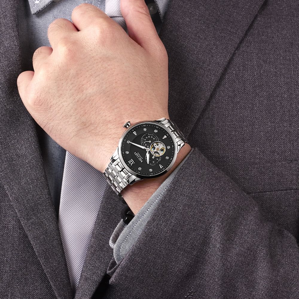 MEGIR 62053 automatic watch on the wrist, silver case and bracelet with black open-heart dial, with suit