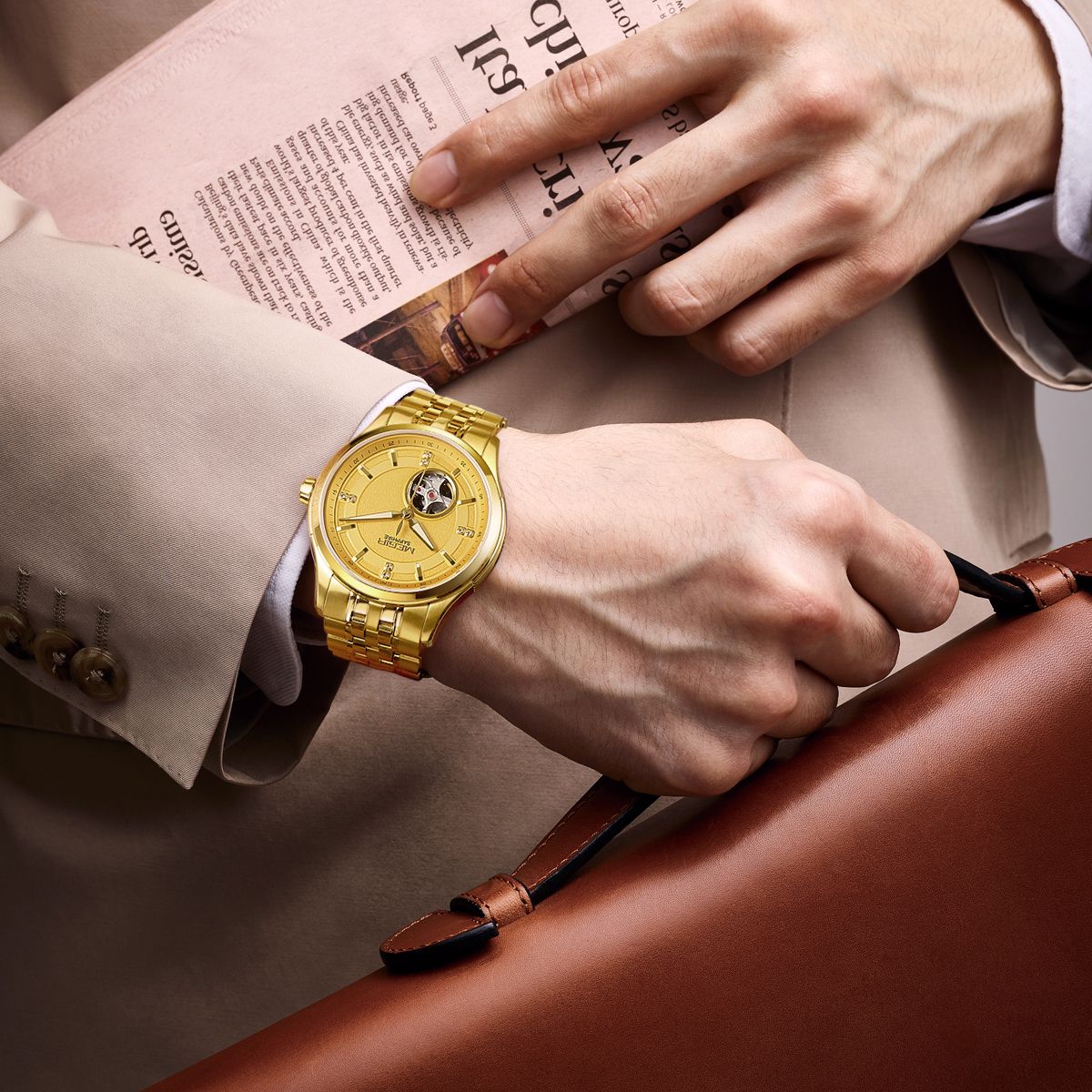 MEGIR 62055 automatic watch on the wrist, gold-tone case and bracelet with gold open-heart dial, with newspaper