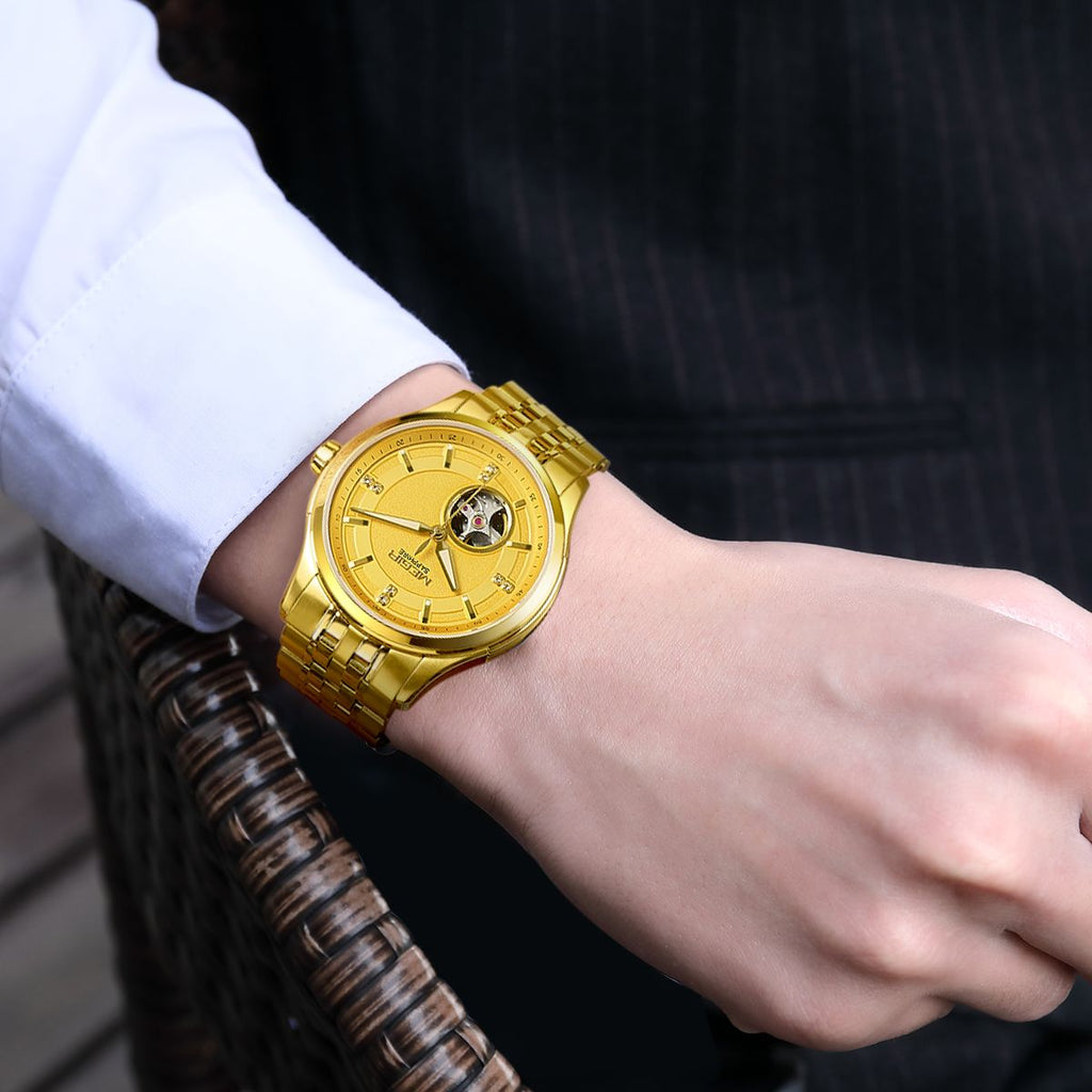 MEGIR 62055 automatic watch on the wrist, gold-tone case and bracelet with gold open-heart dial