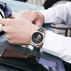 MEGIR 62055 automatic watch on the wrist, silver case and bracelet with black open-heart dial