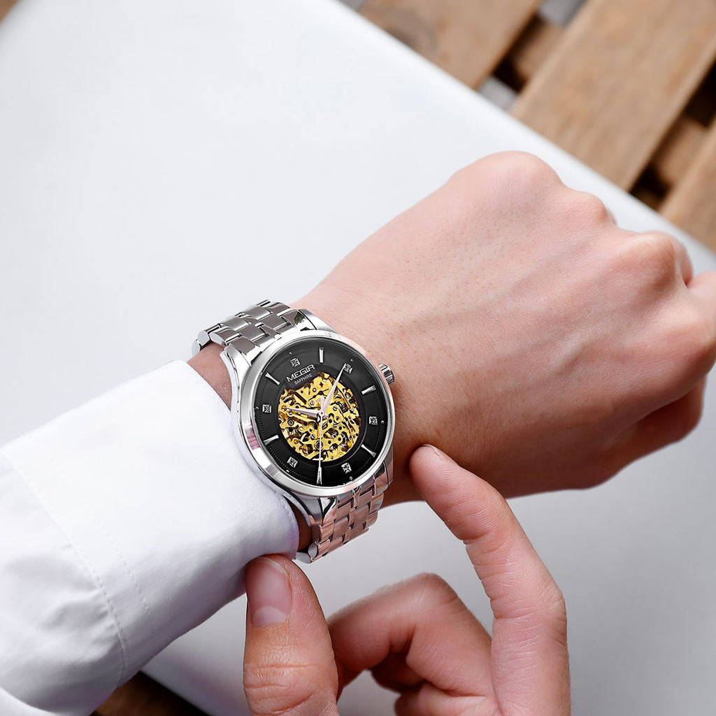 MEGIR 62058 skeleton automatic watch on the wrist, silver case and bracelet with black-ring skeleton dial