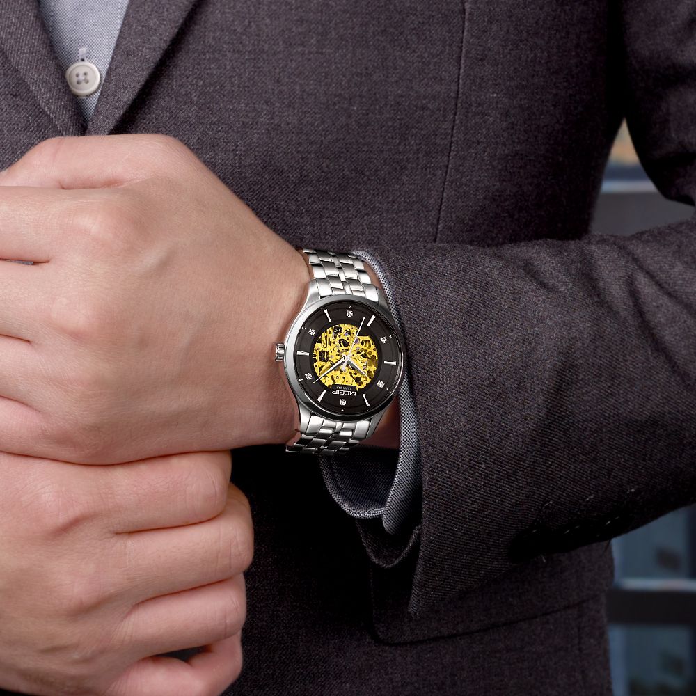 MEGIR 62058 skeleton automatic watch on the wrist, silver case and bracelet with black-ring skeleton dial, with suit