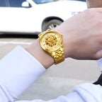 MEGIR 62058 skeleton automatic watch on the wrist, gold-tone case and bracelet with skeleton dial, outdoors