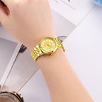 MEGIR 62061 automatic watch on the wrist, gold-tone steel bracelet and gold floral-engraved dial