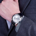 MEGIR 62063 automatic watch on the wrist, silver case, silver-white dial with date and black leather strap, with suit