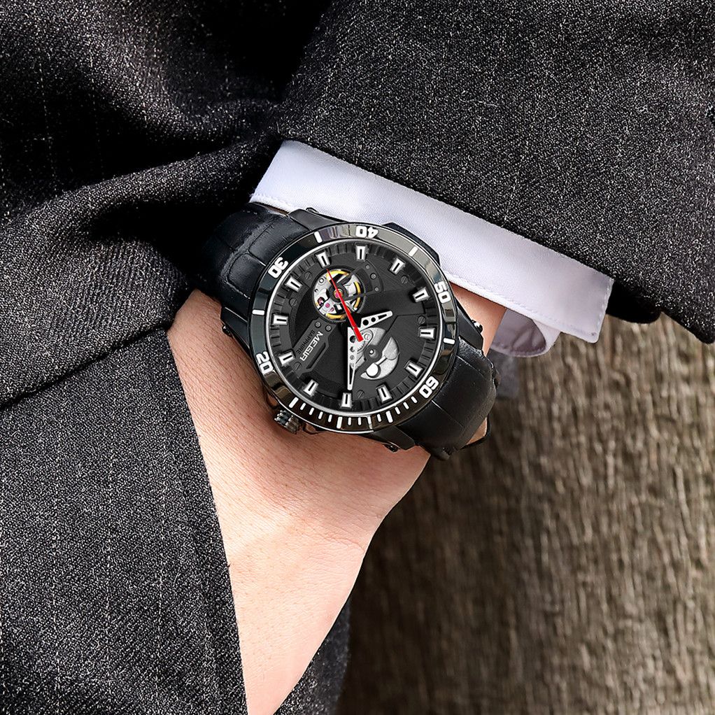 MEGIR 62069 automatic watch on the wrist, black case, black skeleton dial and black leather strap
