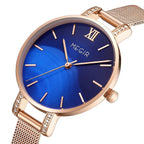 MEGIR 7002 women's quartz watch, rose-gold mesh bracelet and blue dial with crystal-set lugs, angled view