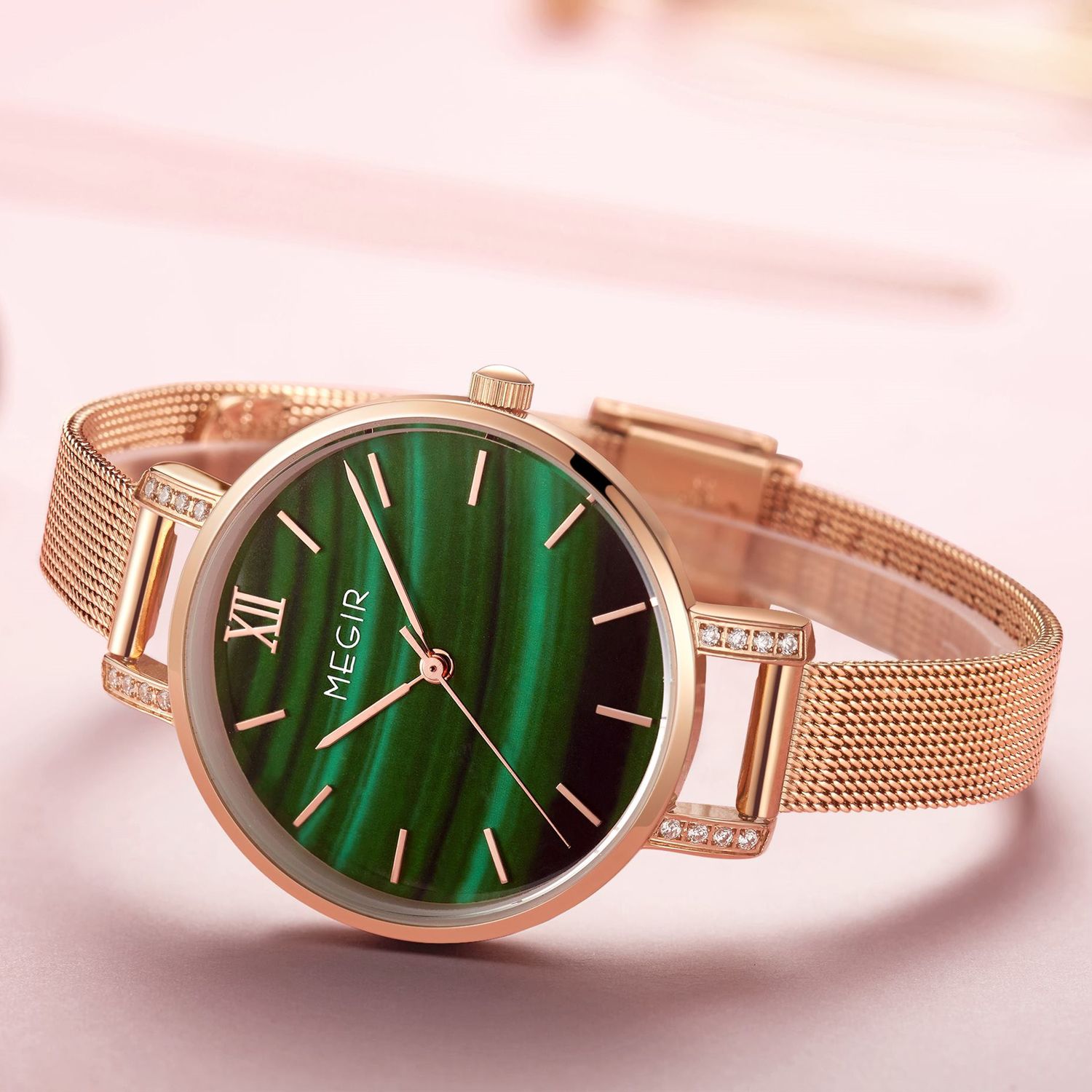 MEGIR 7002 women's quartz watch, rose-gold mesh bracelet and green marbled dial with crystal-set lugs, angled view
