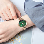 MEGIR 7002 quartz watch on the wrist, rose-gold mesh bracelet and green marbled dial