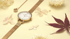 MEGIR 7002 women's quartz watch, rose-gold mesh bracelet and white mother-of-pearl dial, styled with flowers