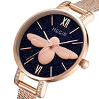 MEGIR 7009 women's quartz watch, rose-gold mesh bracelet and dark-blue starry bee dial, angled view