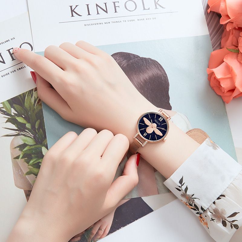MEGIR 7009 quartz watch on the wrist, rose-gold mesh bracelet and dark-blue starry bee dial