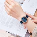 MEGIR 7012 quartz watch on the wrist, rose-gold case, blue dial and blue mesh bracelet