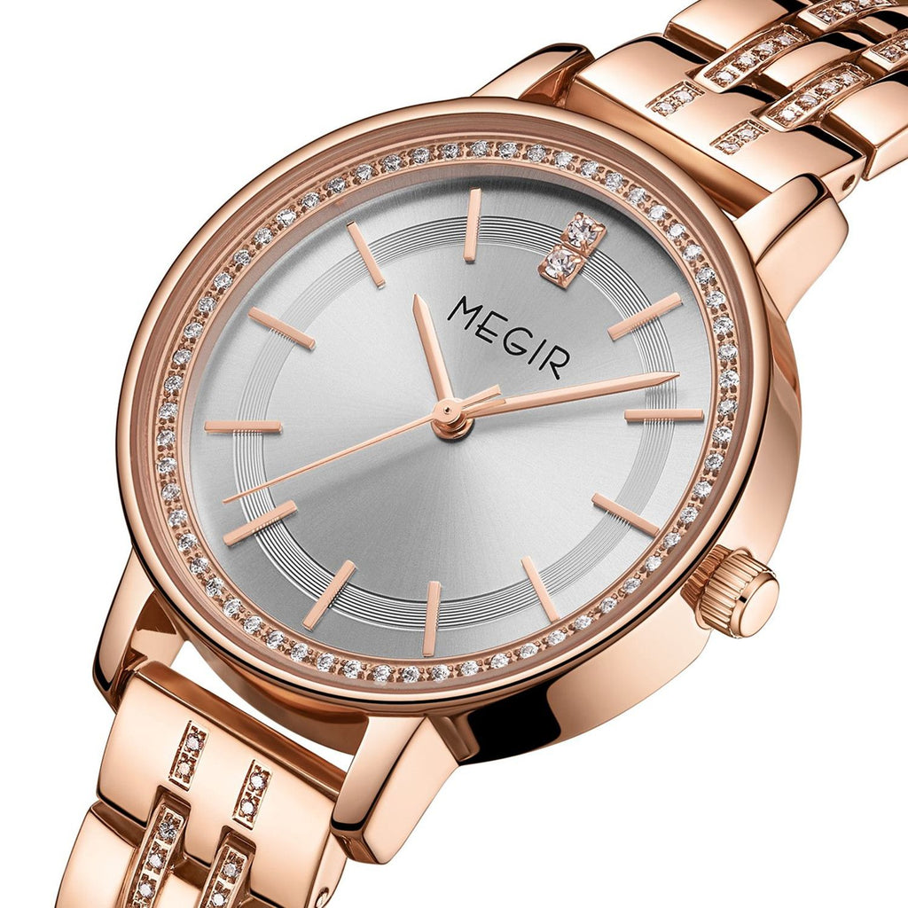 MEGIR 7012 women's quartz watch, rose-gold case, silver-white dial and crystal-set rose-gold bracelet, angled view