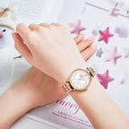 MEGIR 7012 quartz watch on the wrist, rose-gold case, silver-white dial and crystal-set rose-gold bracelet