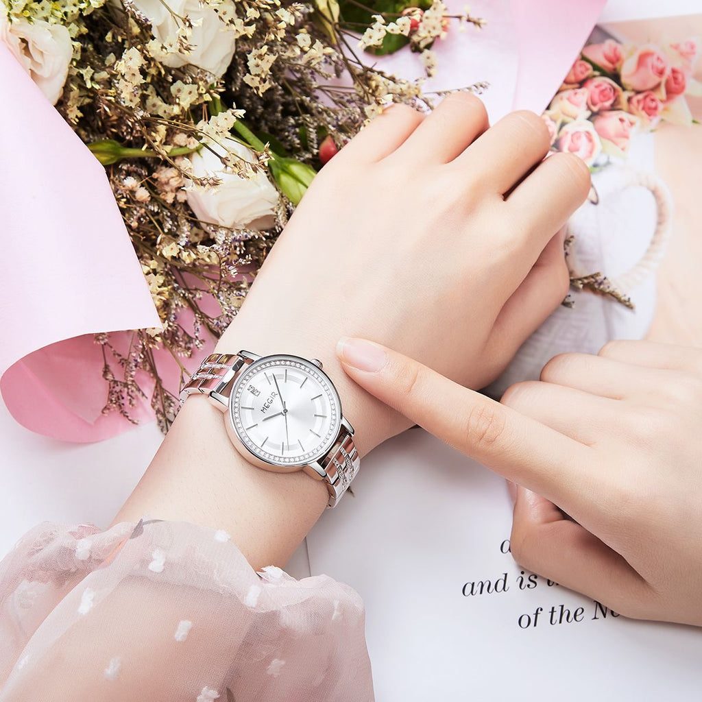 MEGIR 7012 quartz watch on the wrist, silver case, silver-white dial and crystal-set silver bracelet