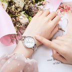 MEGIR 7012 quartz watch on the wrist, silver case, silver-white dial and crystal-set silver bracelet