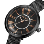 MEGIR 7014 women's quartz watch, black case, black Roman-numeral dial with crystal ring and mesh bracelet, angled