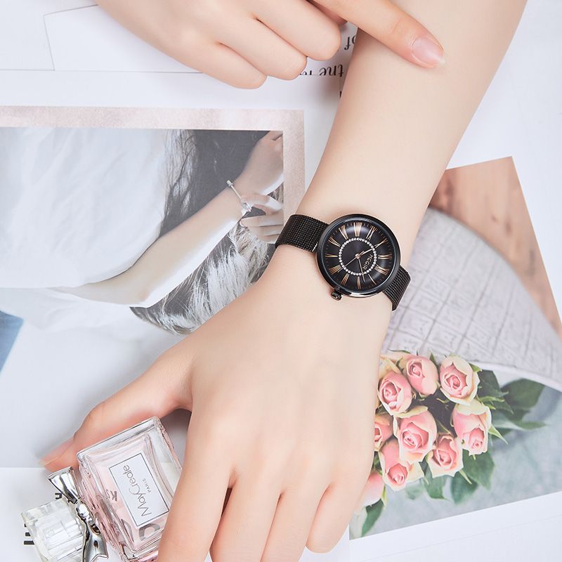 MEGIR 7014 quartz watch on the wrist, black case, black Roman-numeral dial and black mesh bracelet