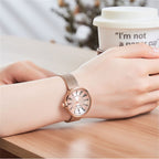 MEGIR 7014 quartz watch on the wrist, rose-gold case, rose Roman-numeral dial and rose-gold mesh bracelet