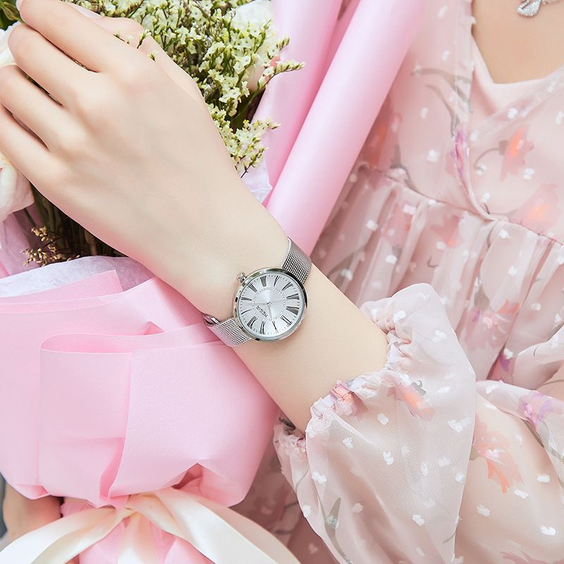 MEGIR 7014 quartz watch on the wrist, silver case, white Roman-numeral dial and silver mesh bracelet