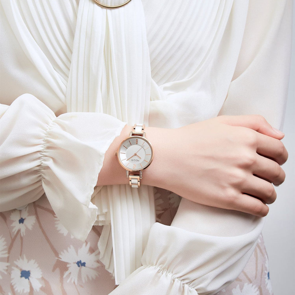 MEGIR 7016 quartz watch on the wrist, rose-gold case, silver-white dial and white-and-rose-gold link bracelet