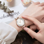 MEGIR 7016 quartz watch on the wrist, rose-gold case, silver-white dial and white link bracelet, with magazine