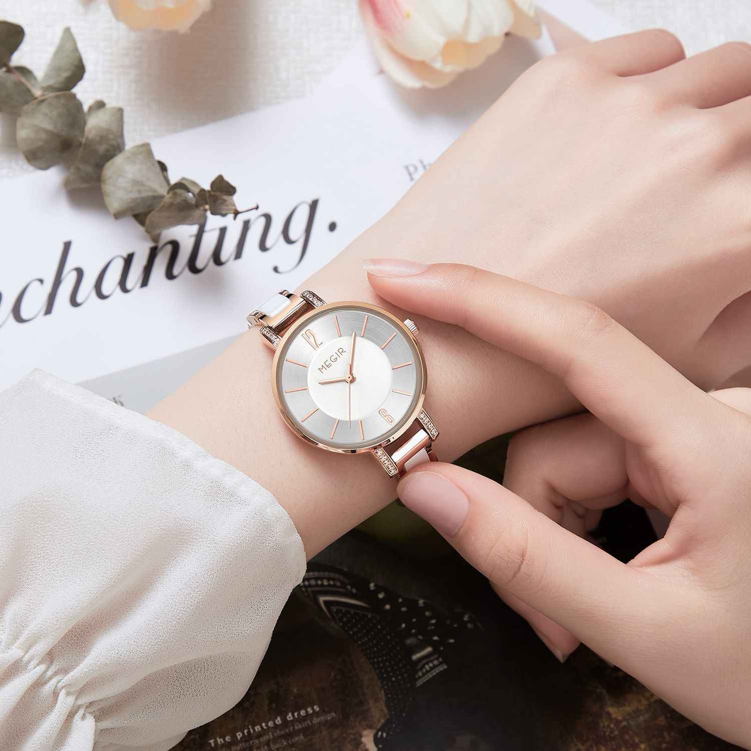 MEGIR 7016 quartz watch on the wrist, rose-gold case, silver-white dial and white link bracelet, with magazine