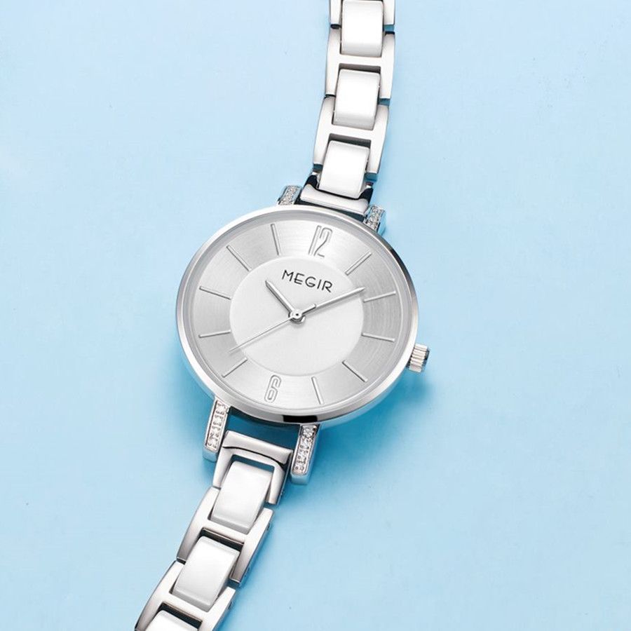 MEGIR 7016 women's quartz watch, silver case, silver-white dial and white link bracelet, styled on blue background