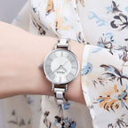 MEGIR 7016 quartz watch on the wrist, silver case, silver-white dial and white-and-silver link bracelet