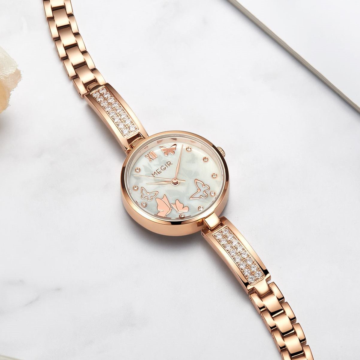 MEGIR 7018 women's diamond quartz watch, rose-gold case, butterfly dial and crystal bracelet, styled on marble