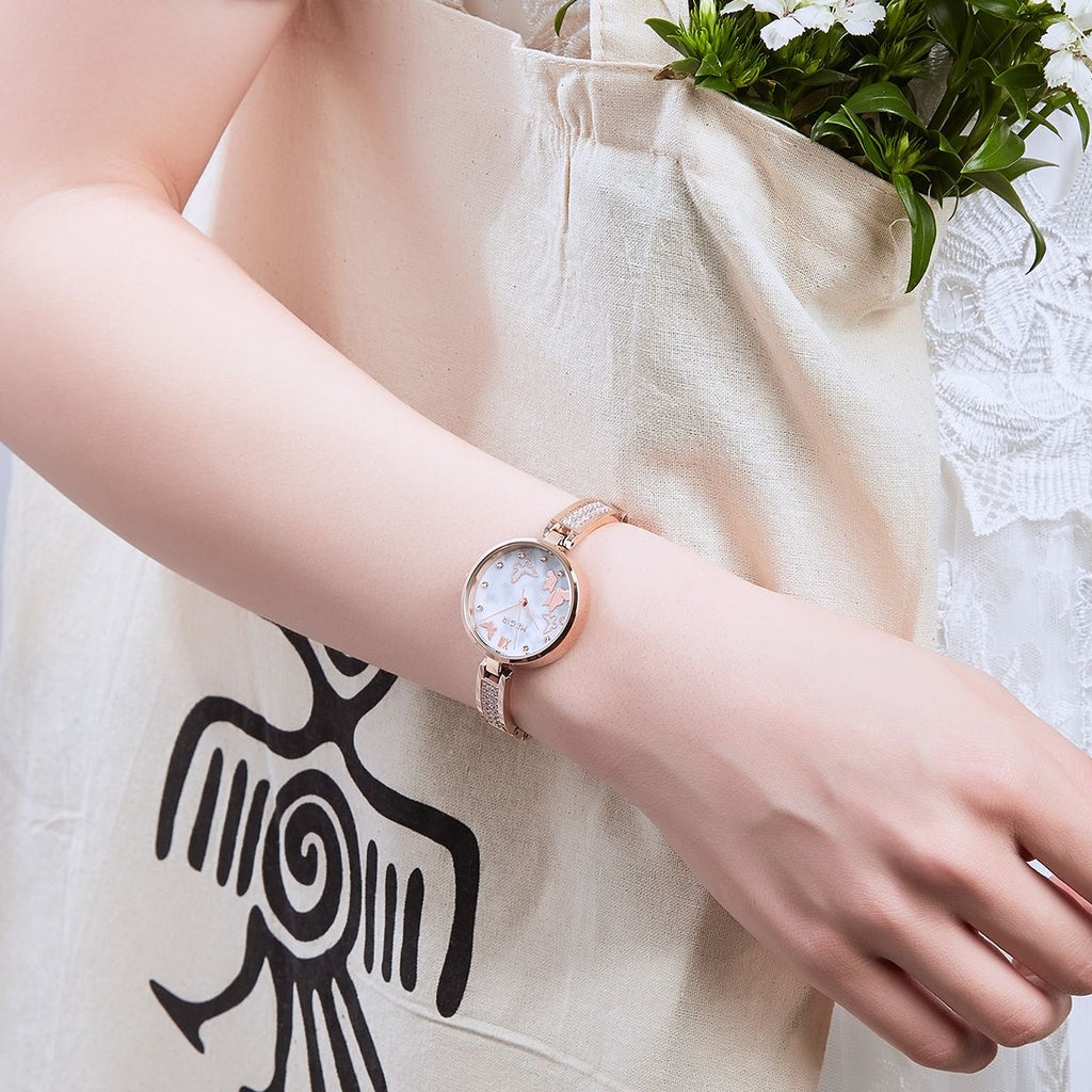 MEGIR 7018 diamond quartz watch on the wrist, rose-gold case, butterfly pearl dial and crystal bracelet