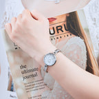 MEGIR 7018 diamond quartz watch on the wrist, silver case, butterfly dial and crystal bracelet, with magazine