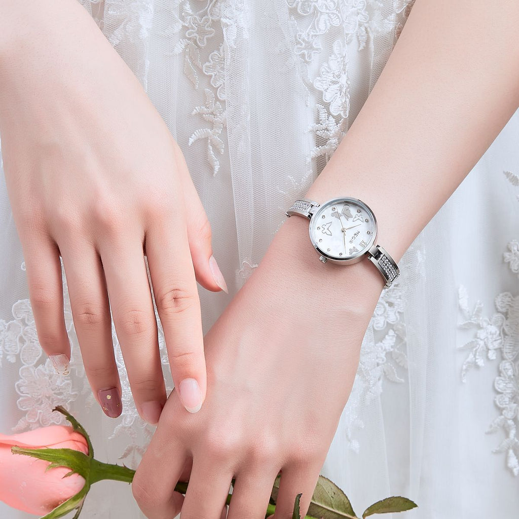 MEGIR 7018 diamond quartz watch on the wrist, silver case, butterfly pearl dial and crystal bracelet