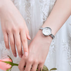 MEGIR 7018 diamond quartz watch on the wrist, silver case, butterfly pearl dial and crystal bracelet
