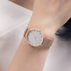 MEGIR 7022 quartz watch on the wrist, white dial and rose-gold mesh bracelet