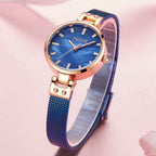 MEGIR 7025 women's quartz watch, blue dial and blue mesh bracelet, styled on pink silk