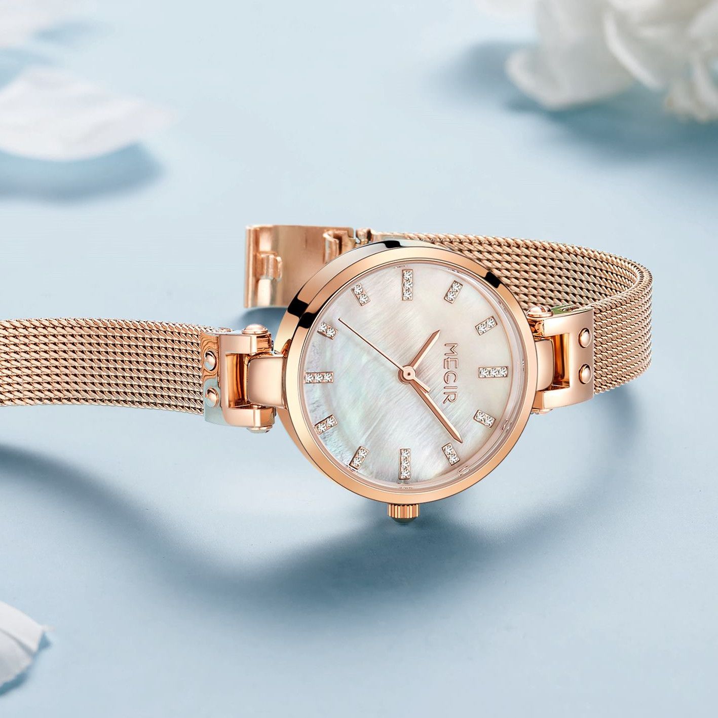 MEGIR 7025 women's quartz watch, white dial and rose-gold mesh bracelet, styled side view