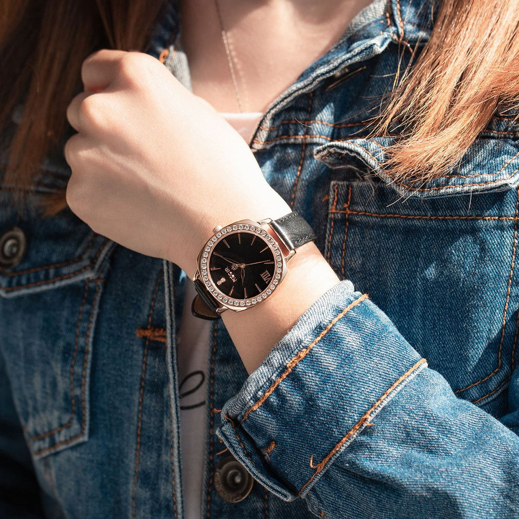 MEGIR 7029 diamond quartz watch on the wrist, rose-gold case, black dial and black leather strap