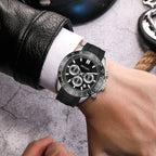 MEGIR 8104 chronograph watch on the wrist, silver case, black dial and black silicone strap