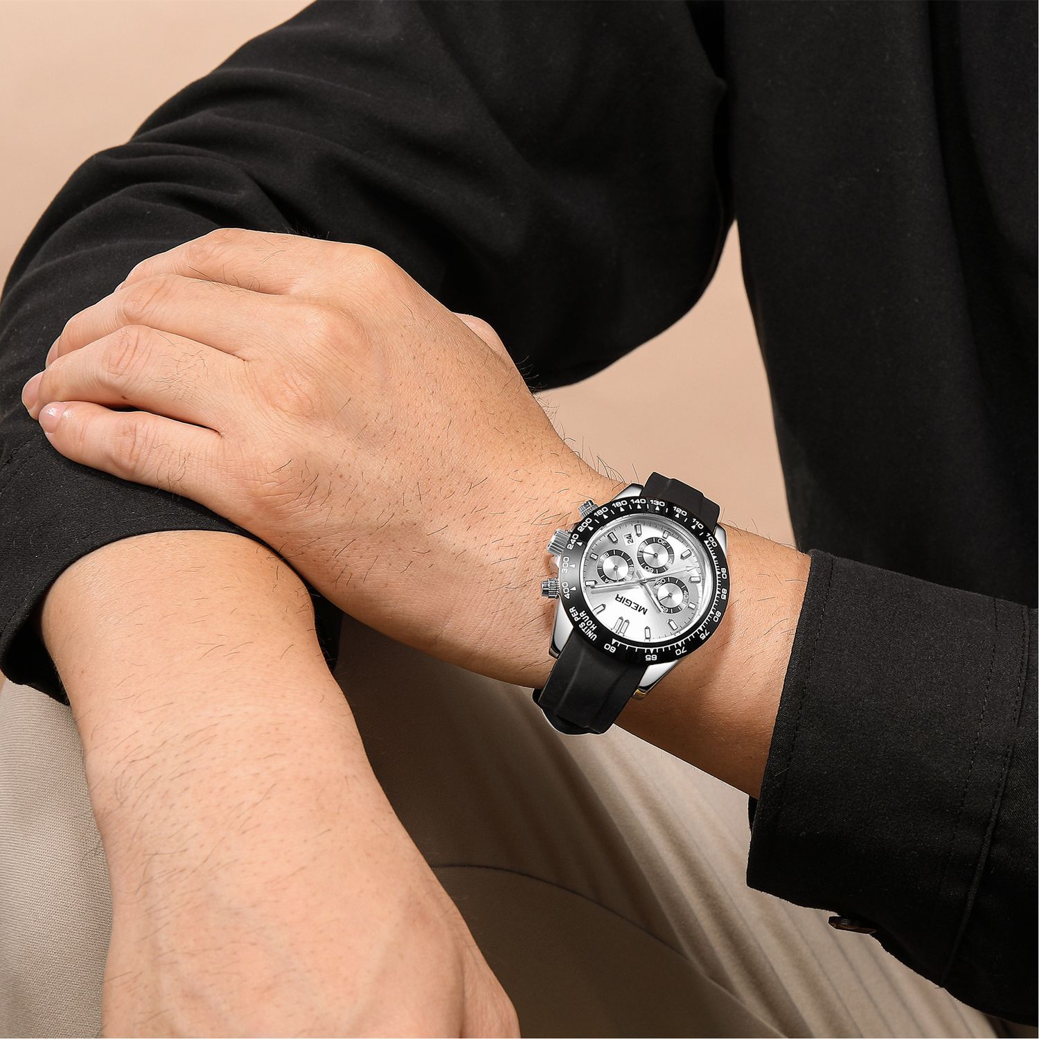 MEGIR 8104 chronograph watch on the wrist, silver case, silver-white dial and black silicone strap