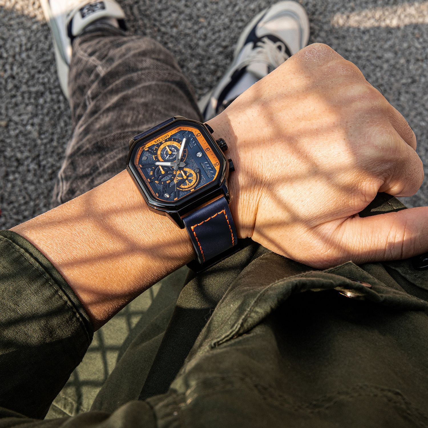 MEGIR 8106 chronograph watch on the wrist, black case, blue and orange dial and blue leather strap