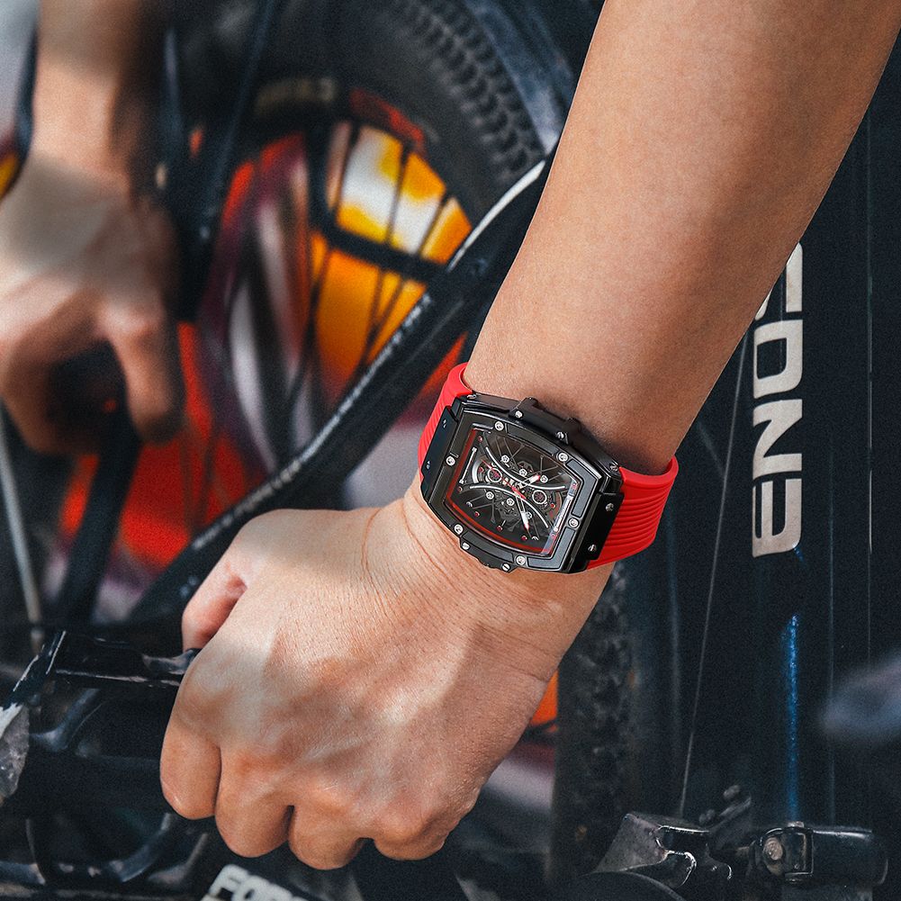 MEGIR 8109 skeleton quartz watch on the wrist, black case, red-accent skeleton dial and red silicone strap