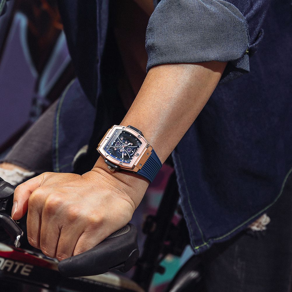 MEGIR 8109 skeleton quartz watch on the wrist, rose-gold case, blue skeleton dial and blue silicone strap
