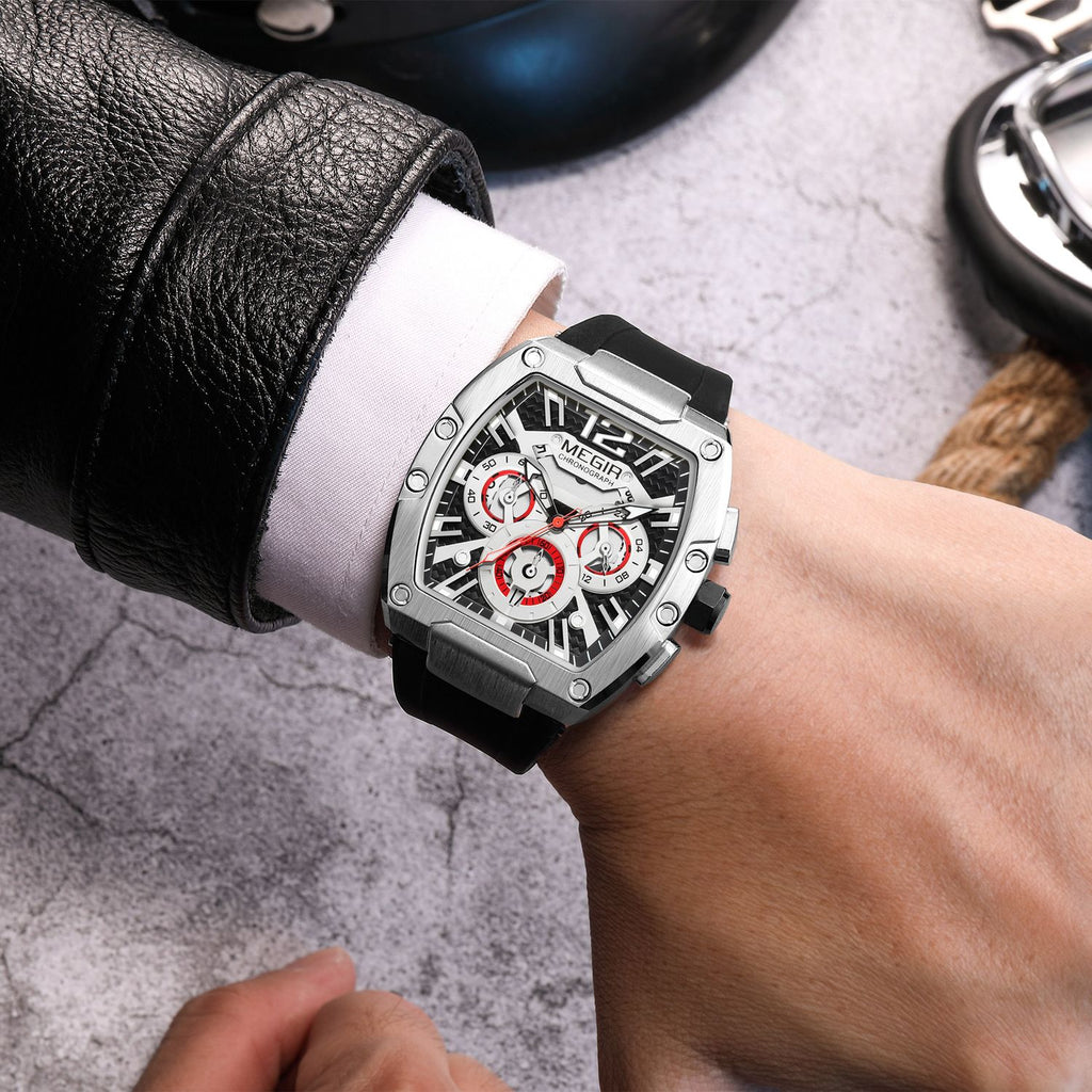 MEGIR 8112 chronograph watch on the wrist, silver tonneau case, skeleton dial with red accents and black silicone strap