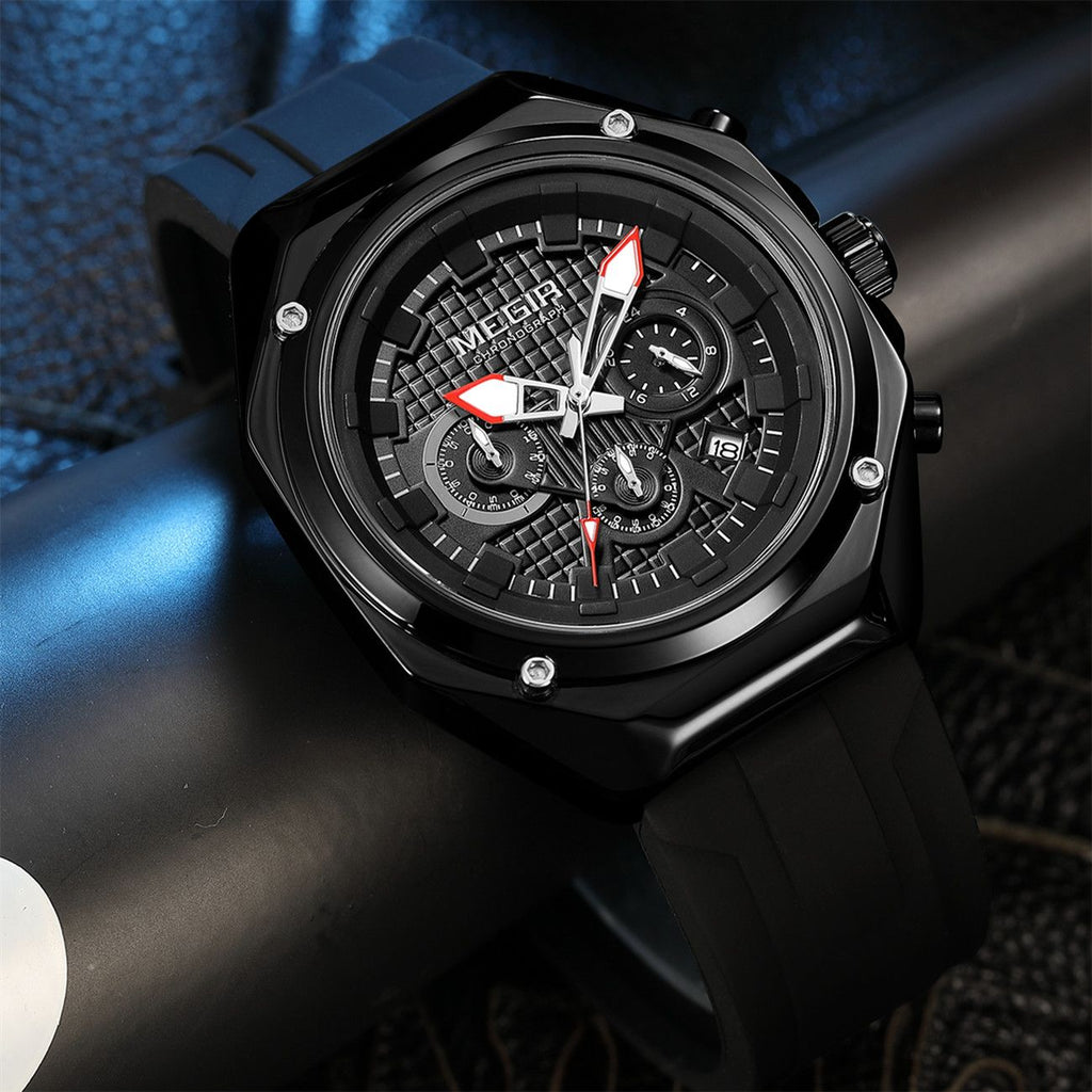 MEGIR 8118 men's chronograph watch, black case, black dial with red-tipped hands and black silicone strap, angled view